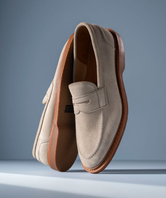 Men’s gray textured leather sneaker with tan rubber sole and brown leather lining